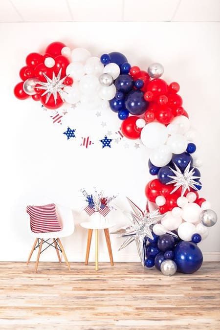 red, white and blue balloon arch